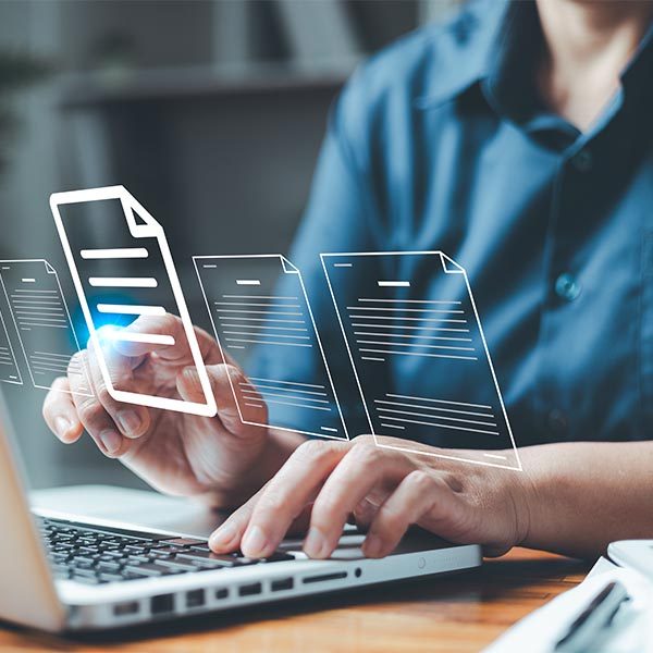 person using a laptop and clicking a floating document icon